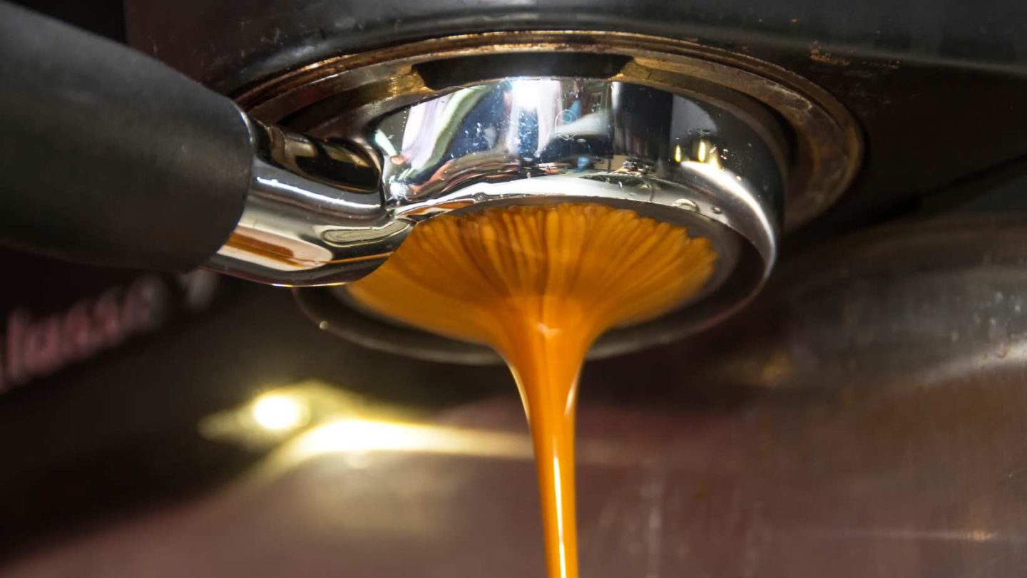 blonde espresso vs regular - dripping espresso out of a machine