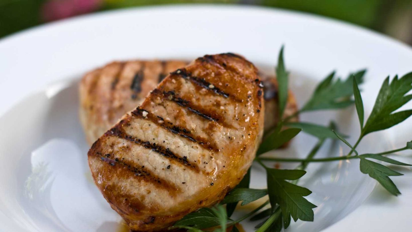 pork chop vs chicken breast - grilled boneless pork chop on a plate