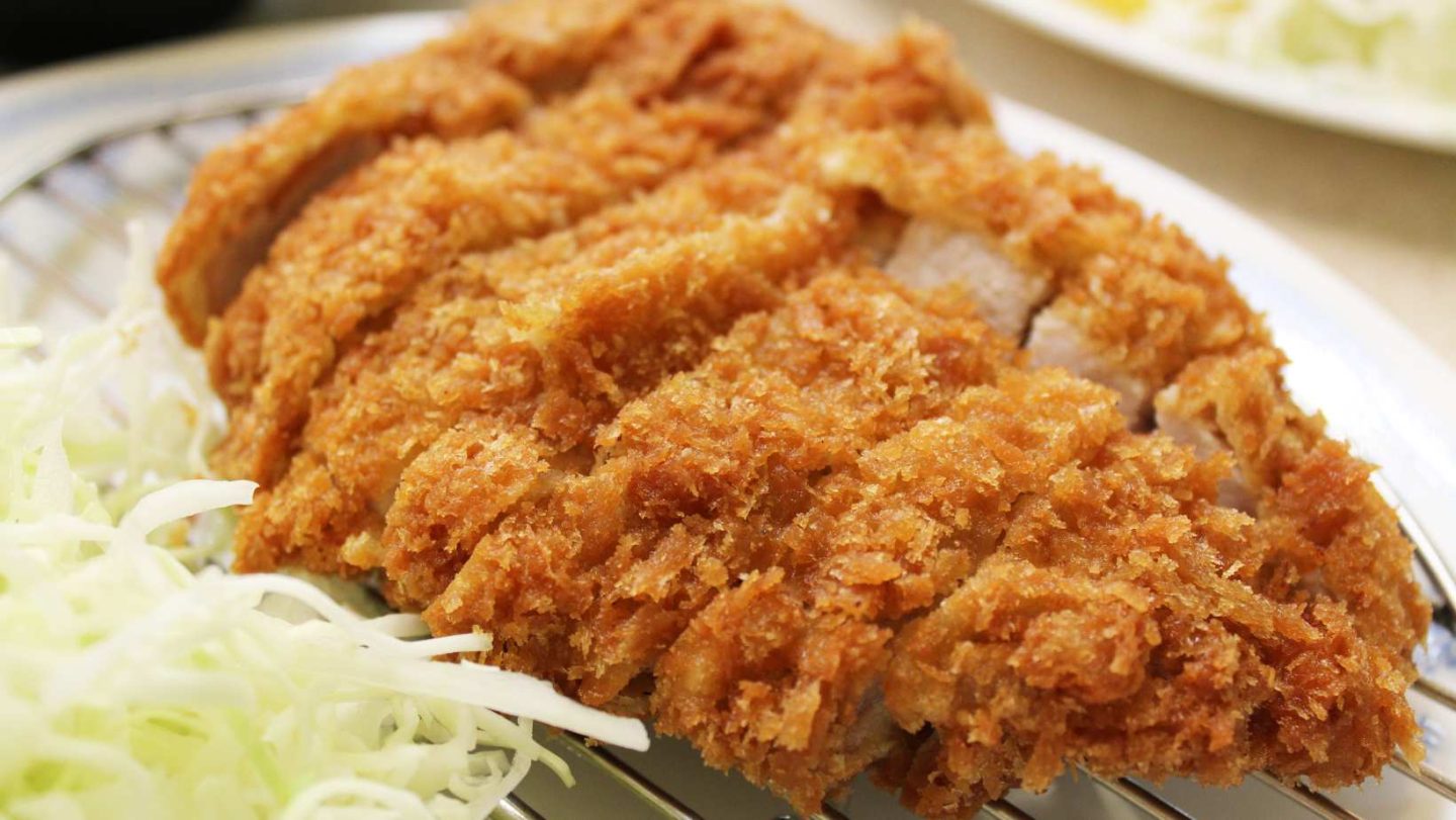Pork Cutlet vs Pork Chop - tonkatsu with cabbage on a plate
